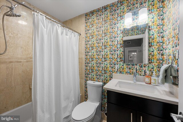 1508 R St NW Unit 2, Washington, DC 20009 - full bath featuring vanity, shower / bath combo, wallpapered walls, and toilet