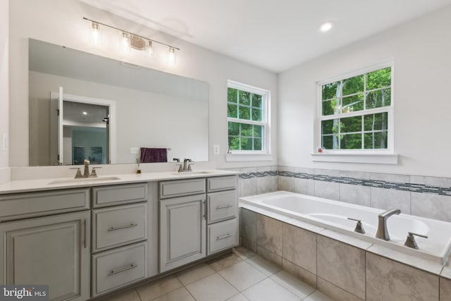 121 Mountain Path Ln, Stafford, VA 22554 - bathroom featuring double vanity, a bath, and tile patterned floors