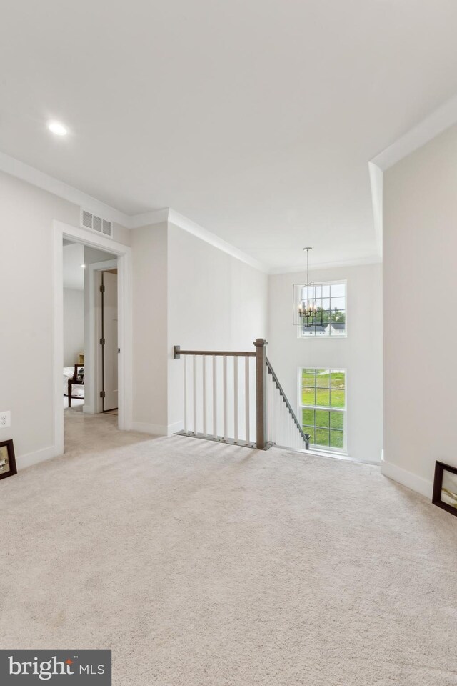 121 Mountain Path Ln, Stafford, VA 22554 - spare room featuring ornamental molding, light colored carpet, a chandelier, baseboards, and recessed lighting