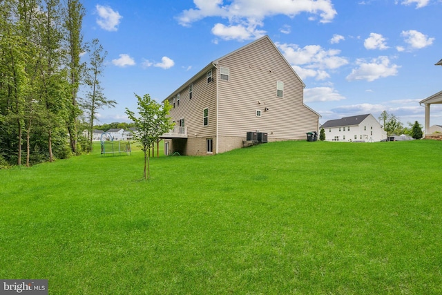 121 Mountain Path Ln, Stafford, VA 22554 - rear view of house featuring a lawn and central air condition unit