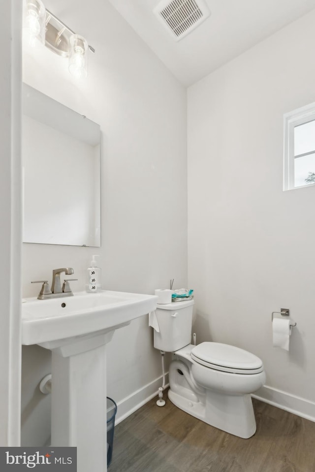 121 Mountain Path Ln, Stafford, VA 22554 - half bath with toilet, baseboards, wood finished floors, and a sink