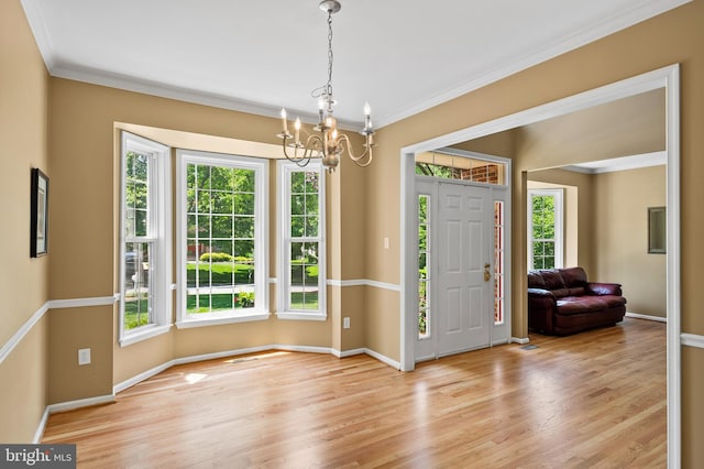 10604 Sourwood Ct, Laurel, MD 20723 - entryway featuring a chandelier, healthy amount of natural light, wood finished floors, and crown molding