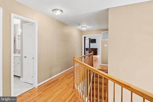10604 Sourwood Ct, Laurel, MD 20723 - corridor featuring an upstairs landing and light wood-style flooring