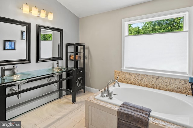 10604 Sourwood Ct, Laurel, MD 20723 - bathroom with a garden tub, double vanity, and tile patterned flooring
