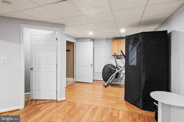 10604 Sourwood Ct, Laurel, MD 20723 - exercise room with light wood-style flooring and a paneled ceiling