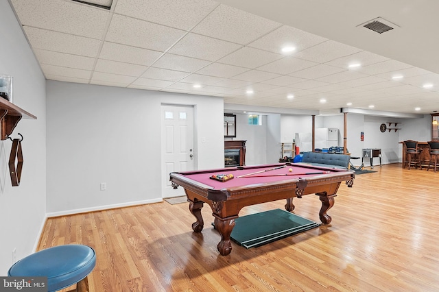 10604 Sourwood Ct, Laurel, MD 20723 - recreation room with light wood-style floors, pool table, a glass covered fireplace, bar, and recessed lighting