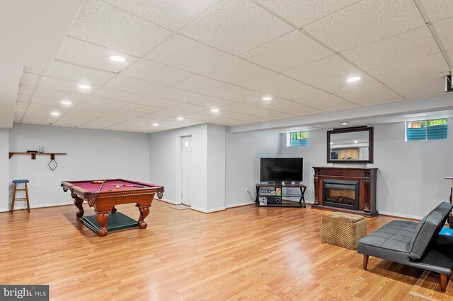 10604 Sourwood Ct, Laurel, MD 20723 - game room featuring light wood finished floors, billiards, and a glass covered fireplace