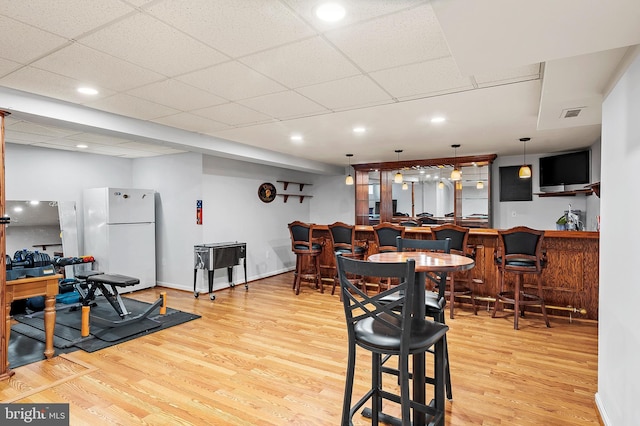 10604 Sourwood Ct, Laurel, MD 20723 - dining space with light wood finished floors, a community bar, and recessed lighting