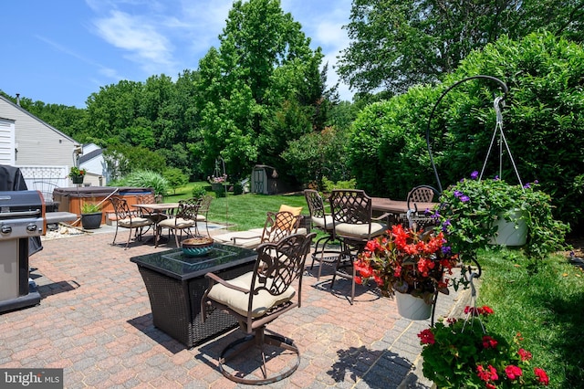 10604 Sourwood Ct, Laurel, MD 20723 - view of patio featuring a hot tub, outdoor dining space, and a shed
