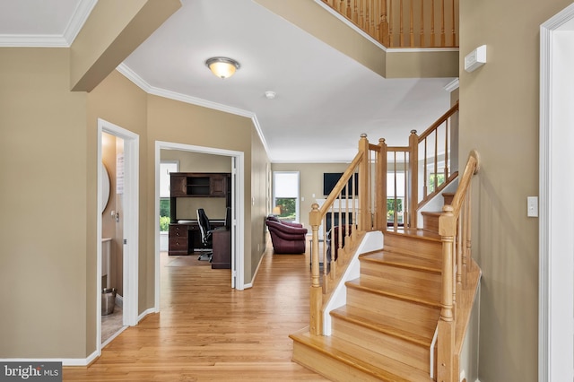 10604 Sourwood Ct, Laurel, MD 20723 - foyer entrance featuring light wood-type flooring, ornamental molding, and stairs