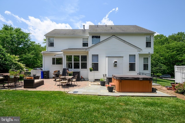 10604 Sourwood Ct, Laurel, MD 20723 - rear view of property featuring a hot tub, a patio, and a yard
