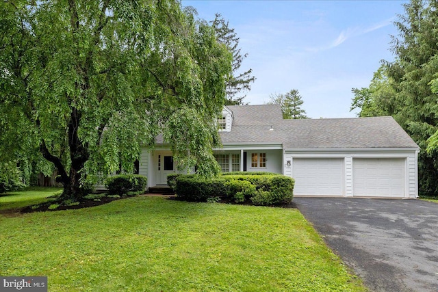 33 Duffield Pl, Princeton, NJ 08540 - view of front of property with asphalt driveway, an attached garage, and a front yard