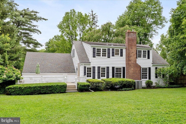 33 Duffield Pl, Princeton, NJ 08540 - view of front facade featuring a front yard, a chimney, a deck, central air condition unit, and a shingled roof