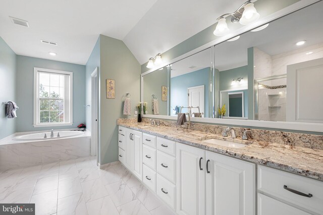 213 Athena Ct, Wilmington, DE 19808 - full bath featuring double vanity, a garden tub, a shower stall, and marble look tile flooring