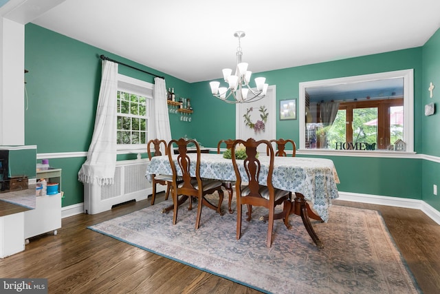 625 Lindley Rd, Glenside, PA 19038 - dining space featuring a chandelier, wood finished floors, baseboards, and radiator heating unit