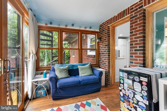 625 Lindley Rd, Glenside, PA 19038 - living room with wood finished floors and brick wall
