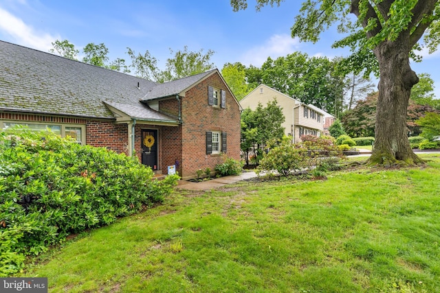 625 Lindley Rd, Glenside, PA 19038 - view of front facade with brick siding and a front lawn