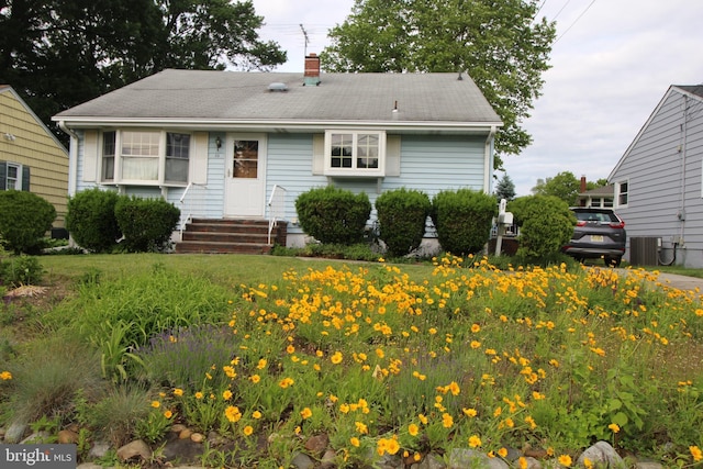65 Albert Ave, Milltown, NJ 08850 - bungalow-style home featuring entry steps, a chimney, and cooling unit