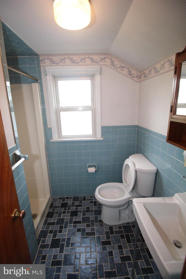 65 Albert Ave, Milltown, NJ 08850 - full bathroom featuring tile walls, toilet, a shower stall, wainscoting, and a sink