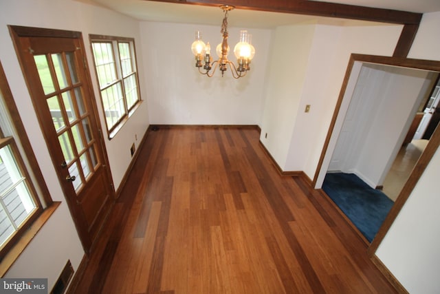 65 Albert Ave, Milltown, NJ 08850 - unfurnished dining area featuring dark wood-style floors, a chandelier, and baseboards