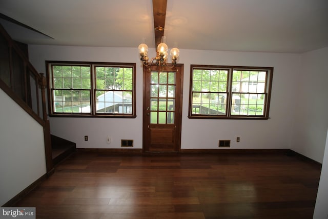 65 Albert Ave, Milltown, NJ 08850 - unfurnished dining area featuring dark wood-type flooring, a chandelier, plenty of natural light, and stairs