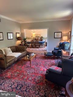 46 Harness Creek View Ct, Annapolis, MD 21403 - living room with ornamental molding and a chandelier