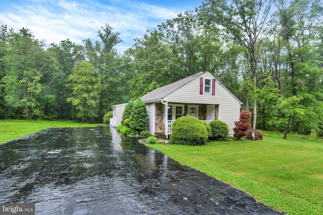 1768 Glen Cove Rd, Darlington, MD 21034 - bungalow-style home with stone siding, a front lawn, covered porch, and asphalt driveway