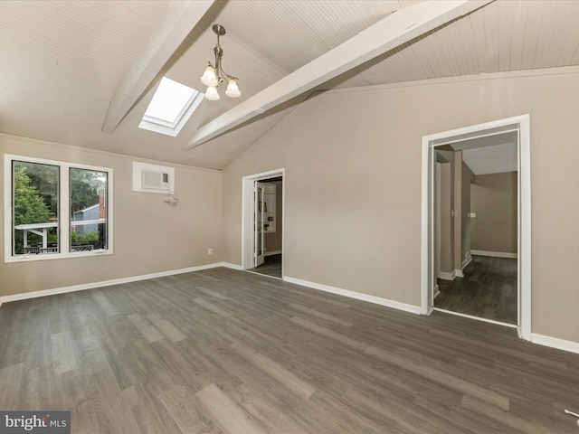 8709 Bradford Rd, Silver Spring, MD 20901 - empty room featuring a skylight, dark wood-type flooring, baseboards, and a chandelier