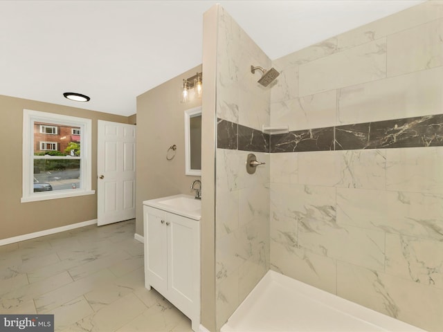 8709 Bradford Rd, Silver Spring, MD 20901 - bathroom with marble look tile flooring, tiled shower, vanity, and baseboards