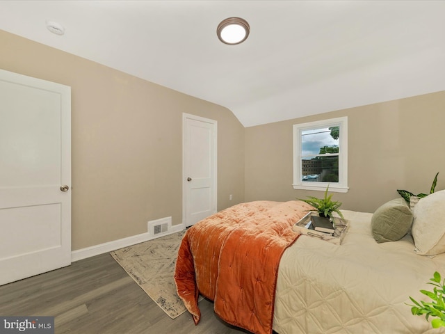 8709 Bradford Rd, Silver Spring, MD 20901 - bedroom featuring vaulted ceiling, wood finished floors, and baseboards