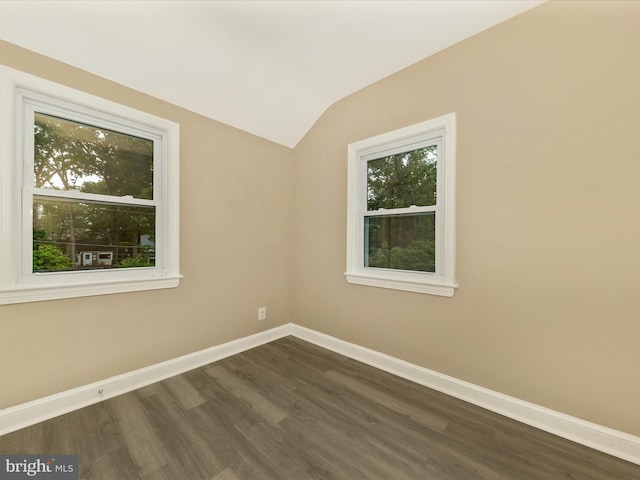 8709 Bradford Rd, Silver Spring, MD 20901 - unfurnished room with lofted ceiling, dark wood-type flooring, and baseboards