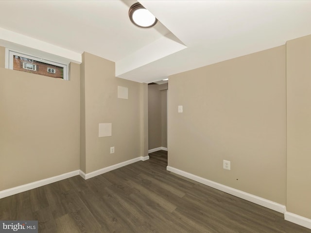 8709 Bradford Rd, Silver Spring, MD 20901 - finished basement featuring dark wood-style floors and baseboards