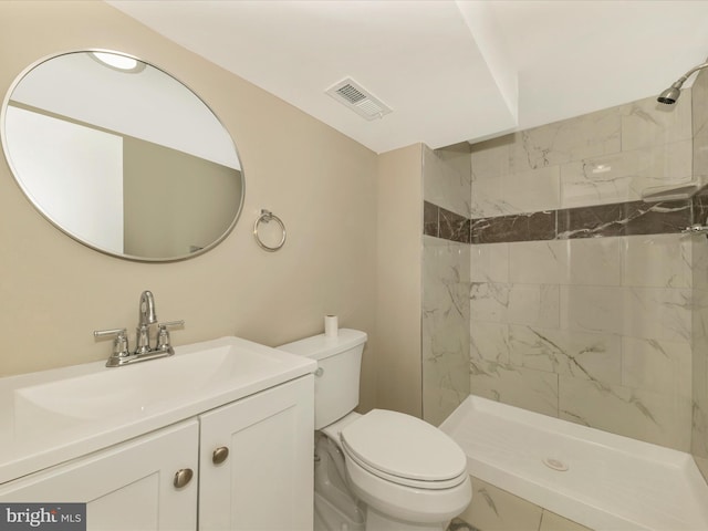 8709 Bradford Rd, Silver Spring, MD 20901 - full bathroom with vanity, tiled shower, and toilet