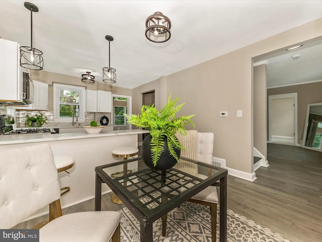 8709 Bradford Rd, Silver Spring, MD 20901 - dining area with dark wood finished floors and baseboards