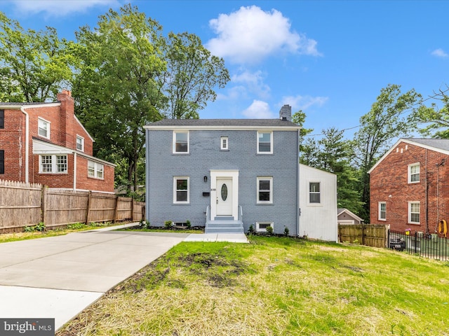 8709 Bradford Rd, Silver Spring, MD 20901 - view of front of property featuring brick siding and a chimney