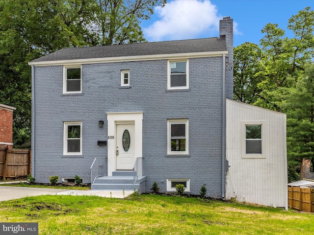 8709 Bradford Rd, Silver Spring, MD 20901 - view of front facade with a chimney and brick siding