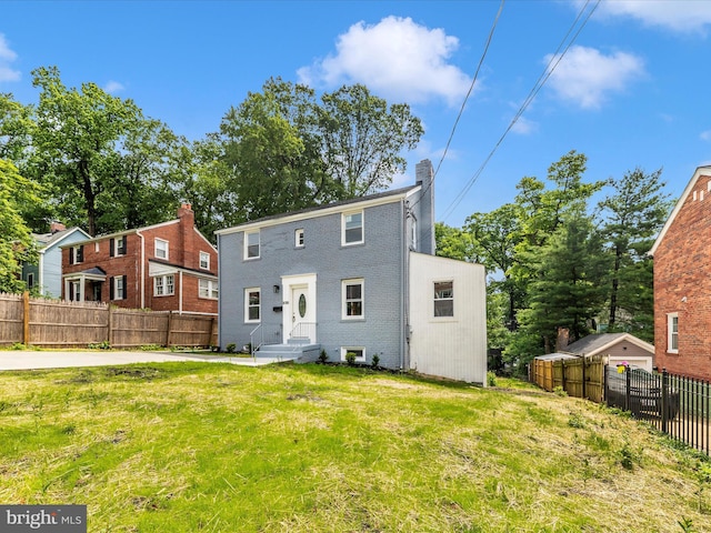 8709 Bradford Rd, Silver Spring, MD 20901 - rear view of property featuring brick siding and a chimney