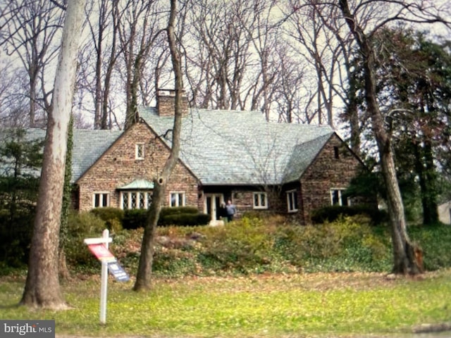 9101 Sligo Creek Pkwy, Silver Spring, MD 20901 - view of front facade with a chimney and stone siding