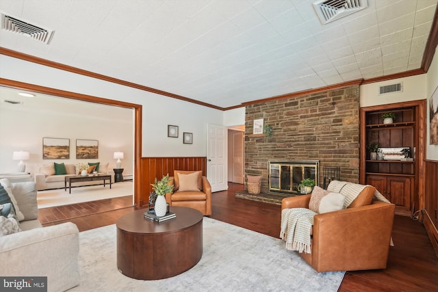 9101 Sligo Creek Pkwy, Silver Spring, MD 20901 - living area featuring wood finished floors, wainscoting, a large fireplace, and ornamental molding