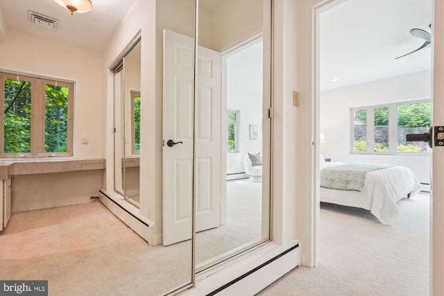 9101 Sligo Creek Pkwy, Silver Spring, MD 20901 - corridor featuring light carpet, a baseboard heating unit, and baseboard heating