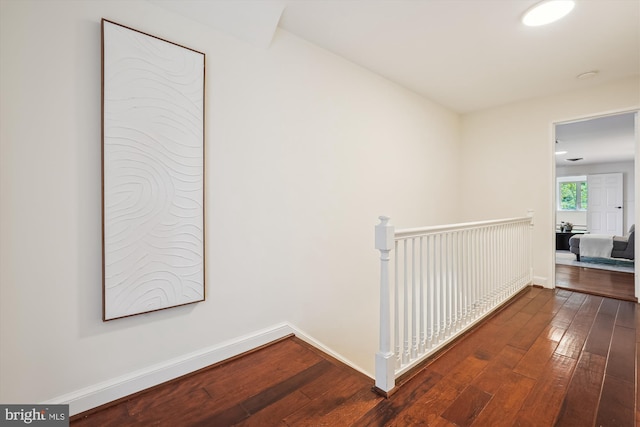 9101 Sligo Creek Pkwy, Silver Spring, MD 20901 - hallway featuring dark wood-style flooring and an upstairs landing
