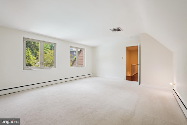 9101 Sligo Creek Pkwy, Silver Spring, MD 20901 - carpeted empty room featuring a baseboard radiator and lofted ceiling