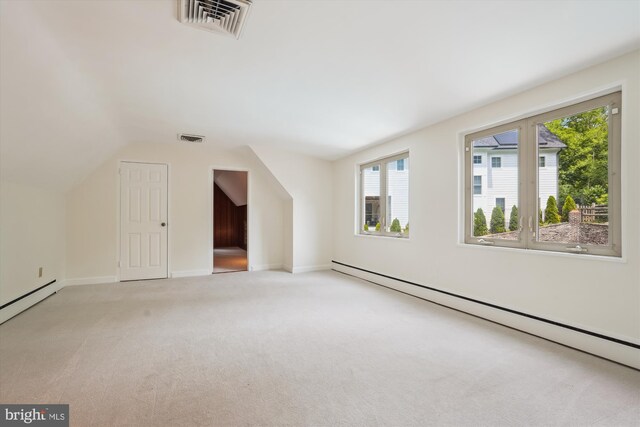 9101 Sligo Creek Pkwy, Silver Spring, MD 20901 - additional living space with a baseboard heating unit, light colored carpet, plenty of natural light, and lofted ceiling