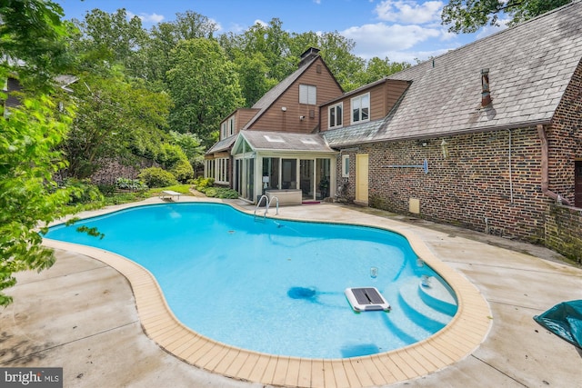 9101 Sligo Creek Pkwy, Silver Spring, MD 20901 - view of pool with a sunroom and a patio area