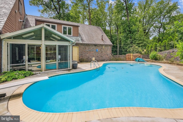 9101 Sligo Creek Pkwy, Silver Spring, MD 20901 - view of pool with a sunroom, a diving board, and a patio area