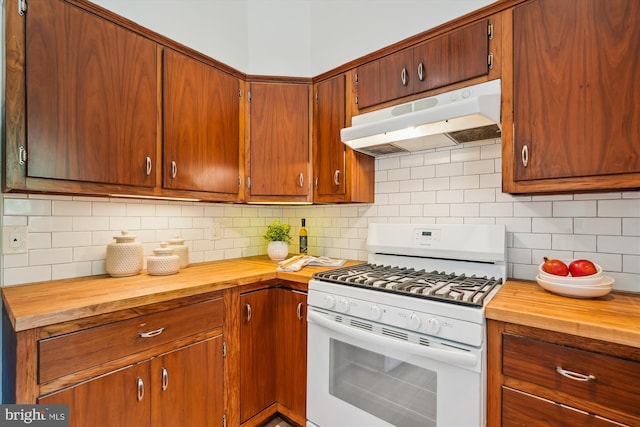 9101 Sligo Creek Pkwy, Silver Spring, MD 20901 - kitchen with white gas stove, under cabinet range hood, butcher block counters, and decorative backsplash