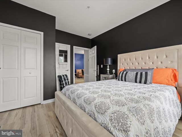 5307 Wyndholme Cir Unit 302, Baltimore, MD 21229 - bedroom with wood finished floors and a closet