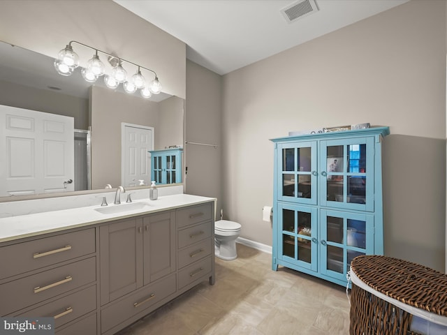 5307 Wyndholme Cir Unit 302, Baltimore, MD 21229 - full bathroom featuring toilet, vanity, baseboards, and an enclosed shower