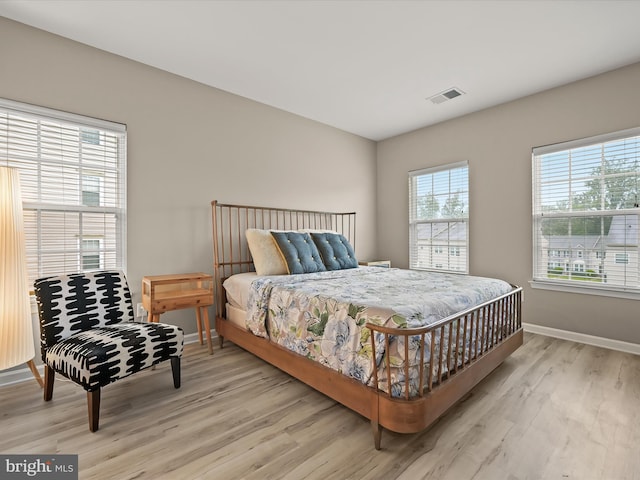 5307 Wyndholme Cir Unit 302, Baltimore, MD 21229 - bedroom with light wood-style flooring and baseboards