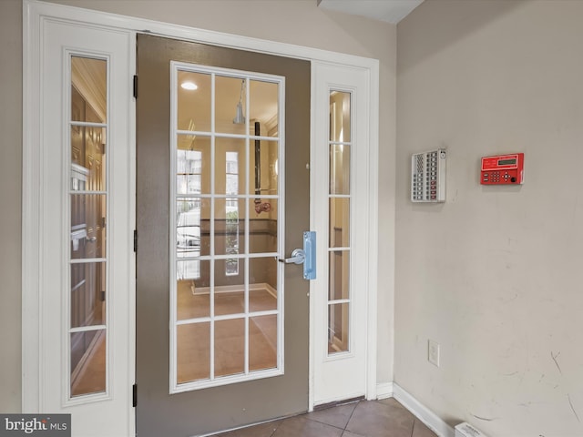 5307 Wyndholme Cir Unit 302, Baltimore, MD 21229 - doorway featuring tile patterned floors, baseboards, and french doors